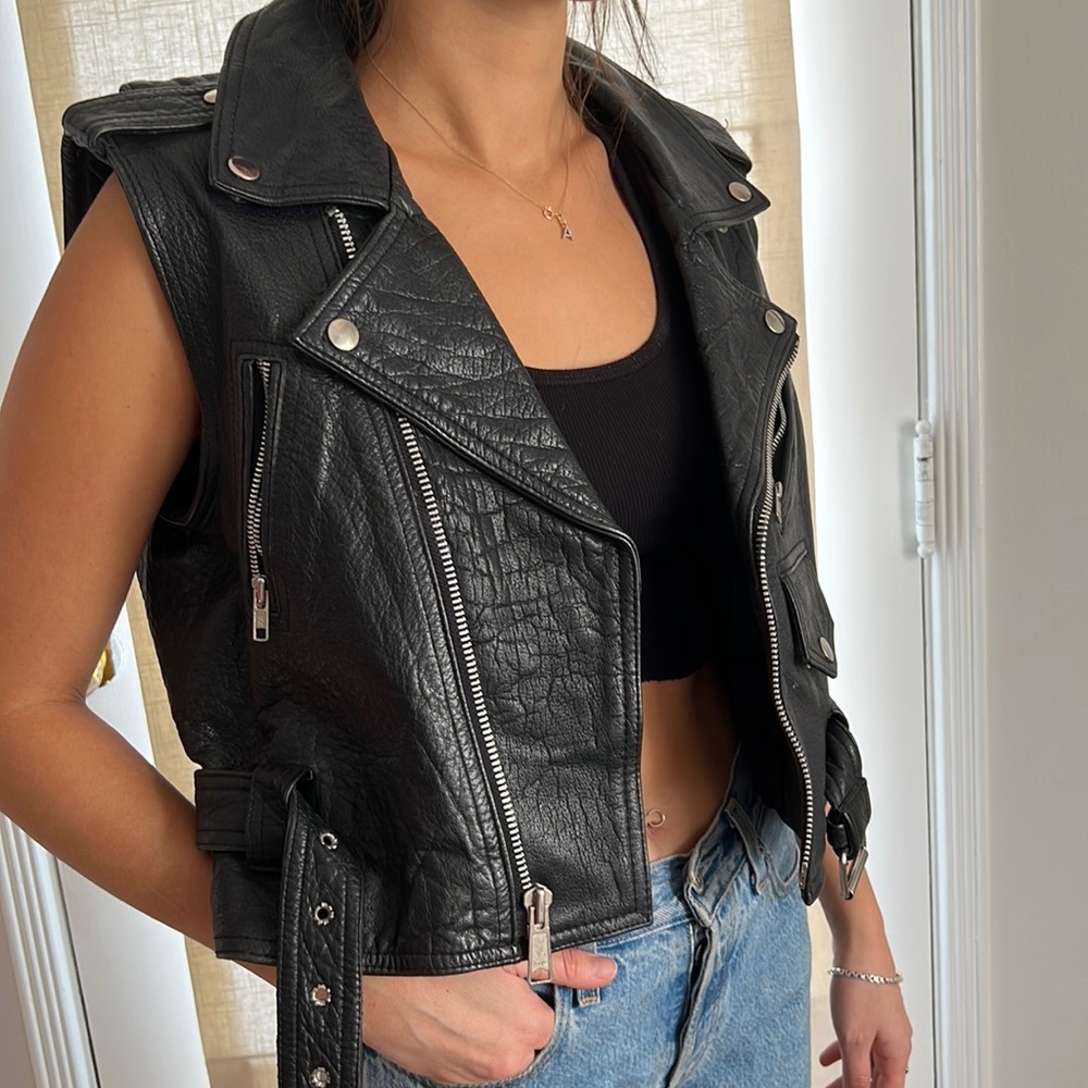 Leather vest with built in backpack